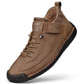 Men's mid-top Martin boot in a solid colour with elastic band, round toe, and tooling stitching on the rubber sole.