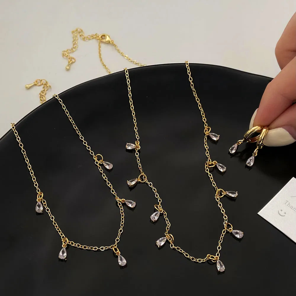 Zircon jewellery set with geometric necklace, earrings and anklet featuring meteor shower design elements