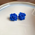 Geometric cloth women's earrings with 30 Silver Needle-blue resin flower colour and round design elements.