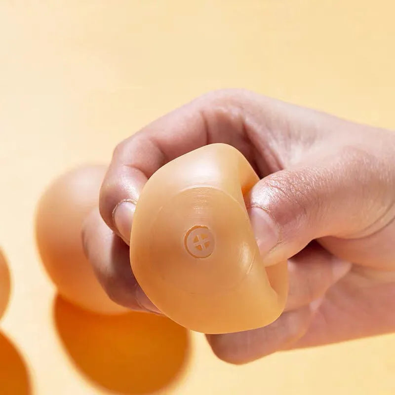 Simulation egg dog toy with sound in assorted colour, rounded plastic design for chewing and fetch play