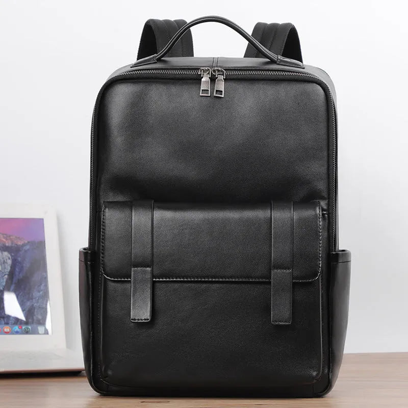Large black genuine leather men's computer backpack with back support plate.