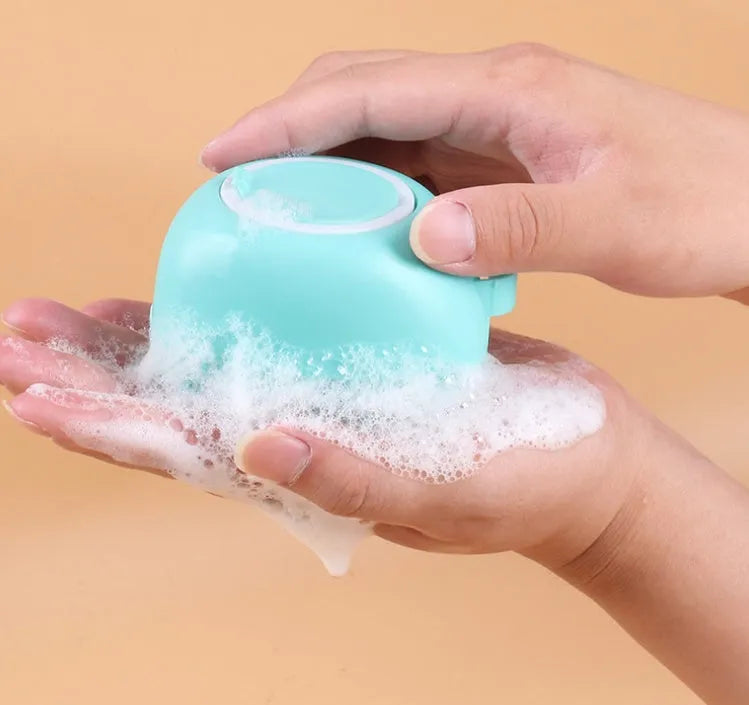 Silicone dog bath brush in blue, pink, and yellow – 9x6x8.5cm pack size