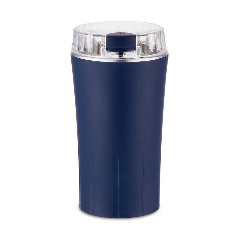 Blue mini flour mill and grinder machine for making seasoning powders on a kitchen counter.