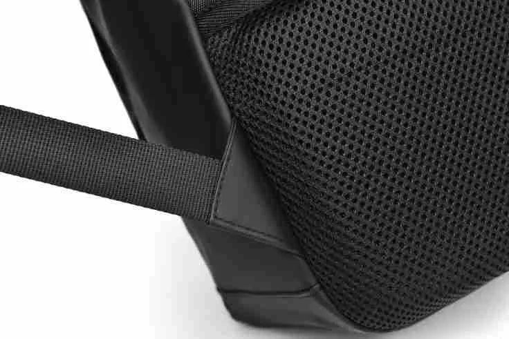 Large simple design waterproof backpack in grey with visible stitching, shown with a separate computer bag.