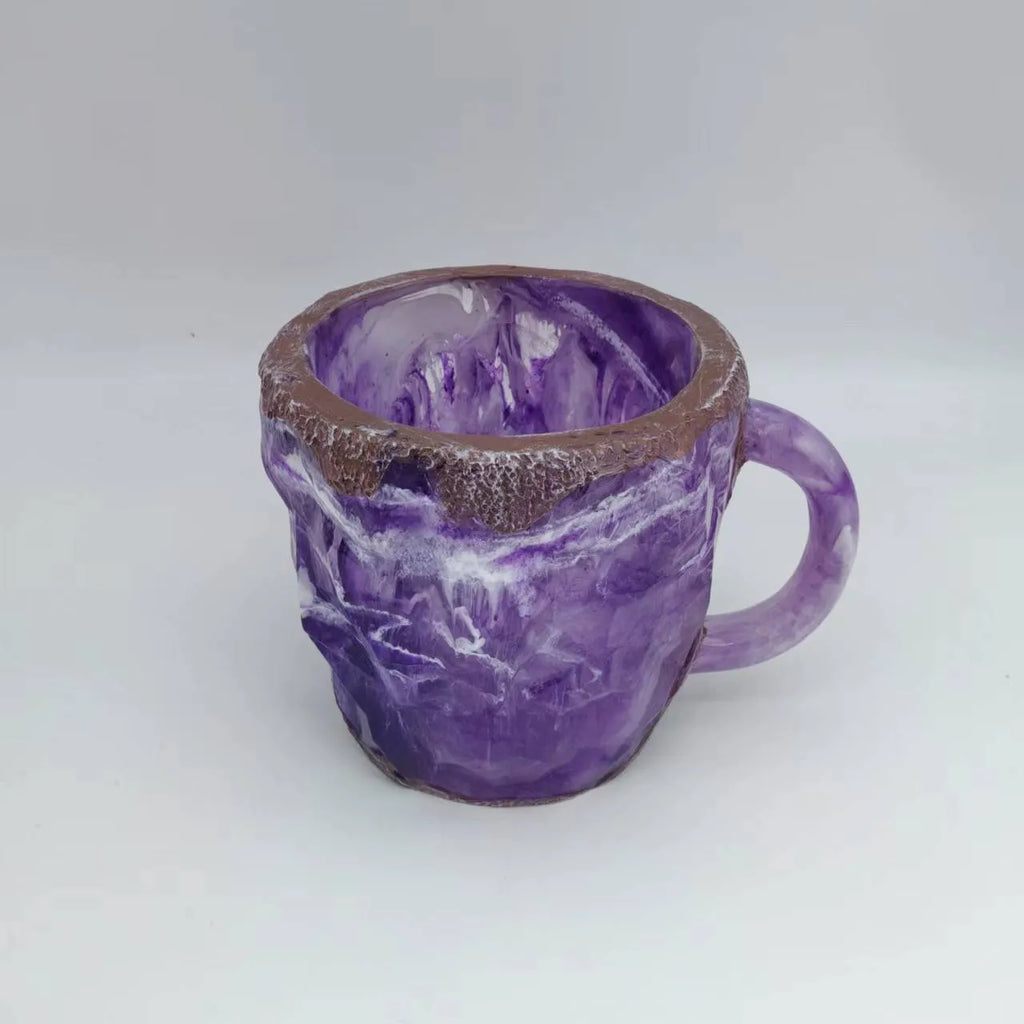 A solid purple resin coffee mug with a handle on a white background.