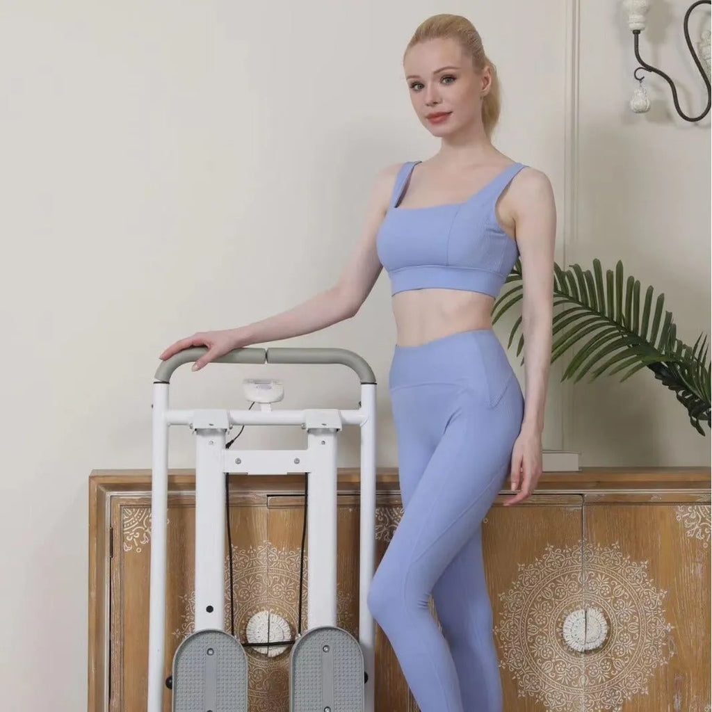 Foldable white treadmill with integrated climbing frame for home fitness workouts