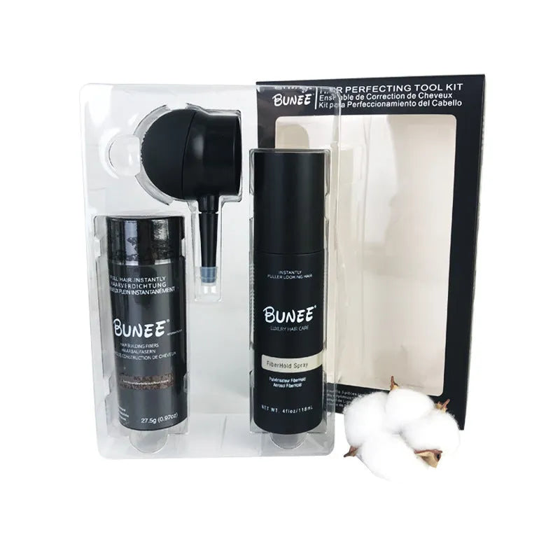 Hair fibre powder kit containing a 275g can, styling spray bottle, and applicator nozzle on a white background.