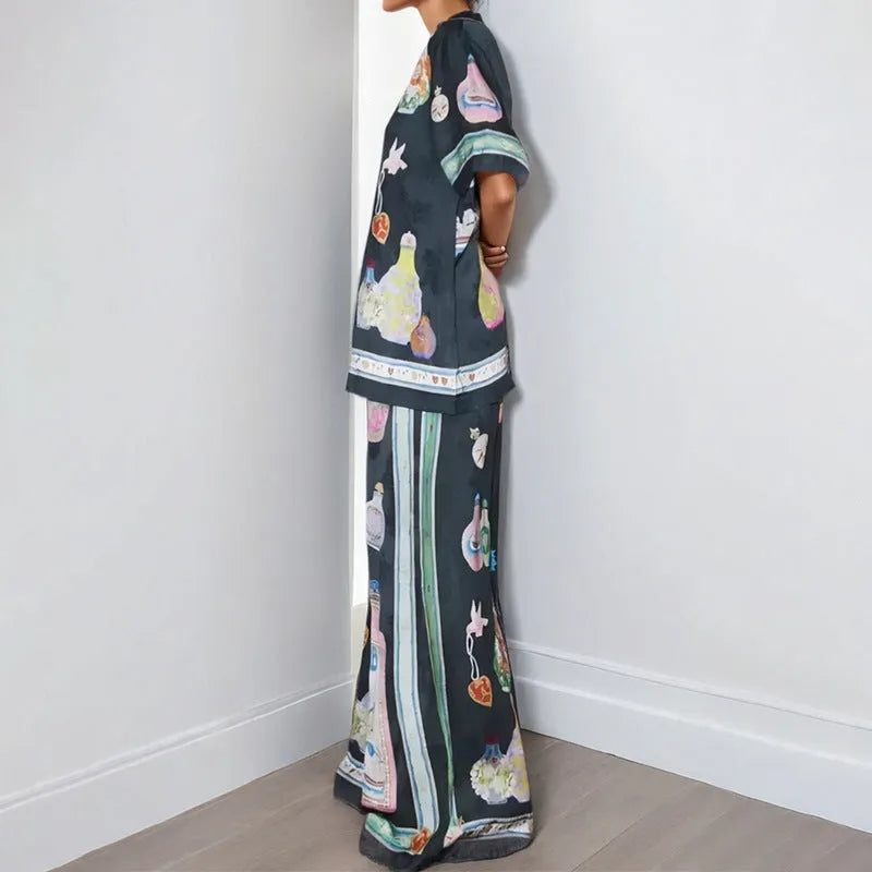 Black women's cartoon print polyester lounge set with cardigan sleeve top and matching trousers