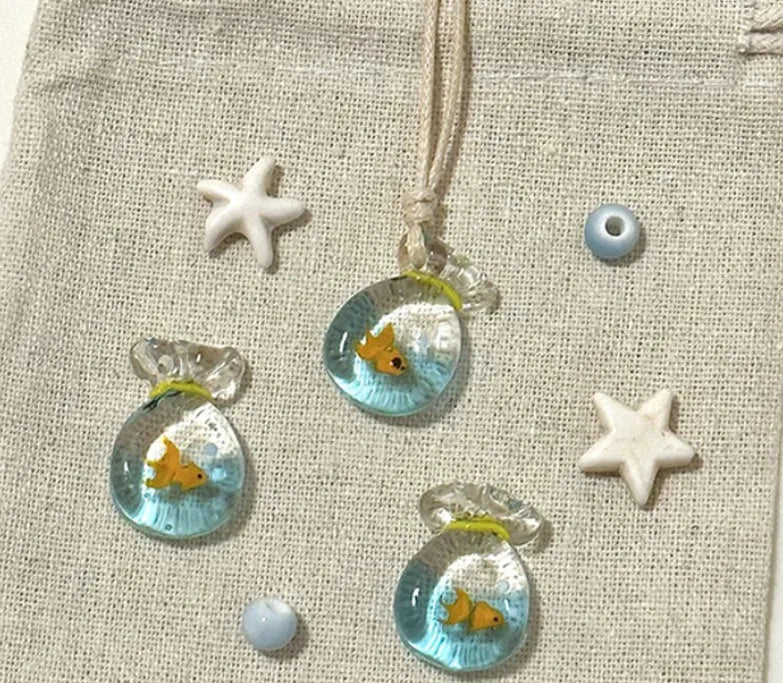 Women's pendant necklace with coloured glaze joker charm on cotton linen chain