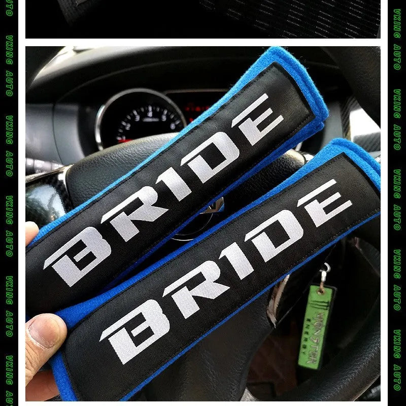 Black car seatbelt shoulder pad made of sponge cloth and cotton, showing embroidery weave detail.