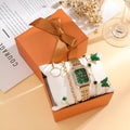 Gold green square watch and four matching bracelets showing alloy construction and jewellery buckles