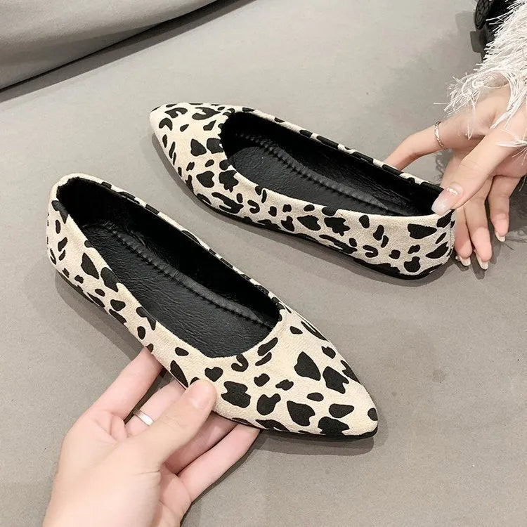 Women's flat pointed toe pumps with leopard print, cotton cloth upper, and low flat heel