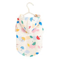 Colourful cartoon umbrella pattern dog raincoat on a model dog, showing polyester fabric and weather protection design.