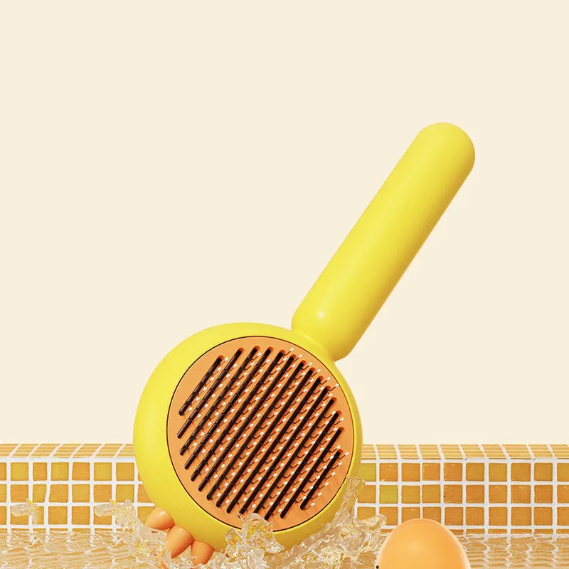 Purple, white, or yellow self-cleaning pet grooming brush with stainless steel bristles.