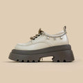 British-style white platform leather shoes with chunky heel and front lace-up closure