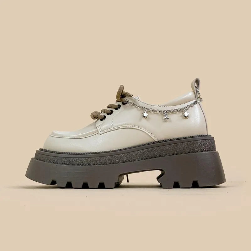 British-style white platform leather shoes with chunky heel and front lace-up closure