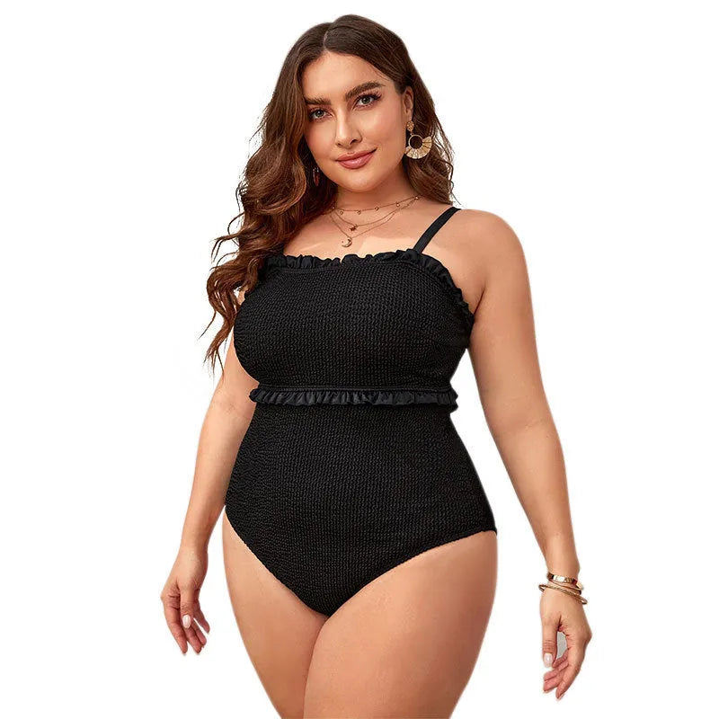 Black plus size one-piece swimsuit with double shoulder straps and belly coverage panel