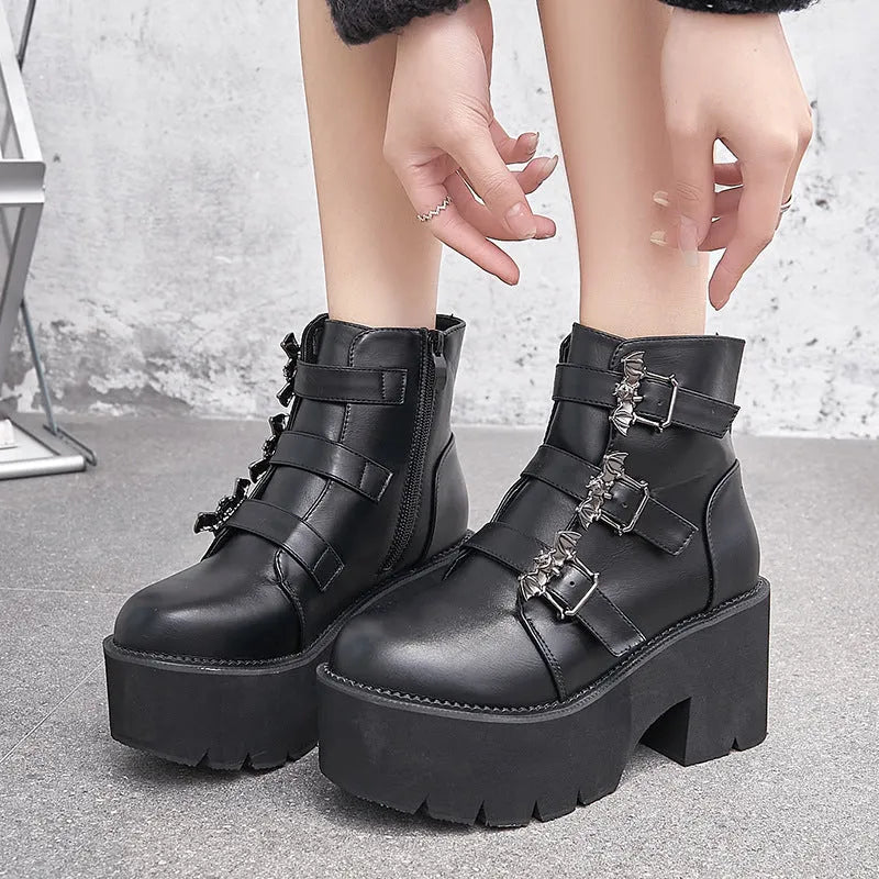 Black women's punk ankle boots with bat buckle and side zip closure