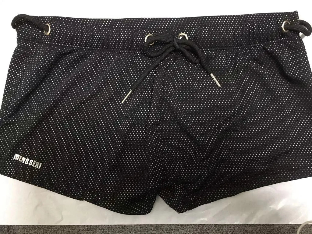 Men's solid colour nylon swimming trunks with polyester lining, shown in multiple colour options.