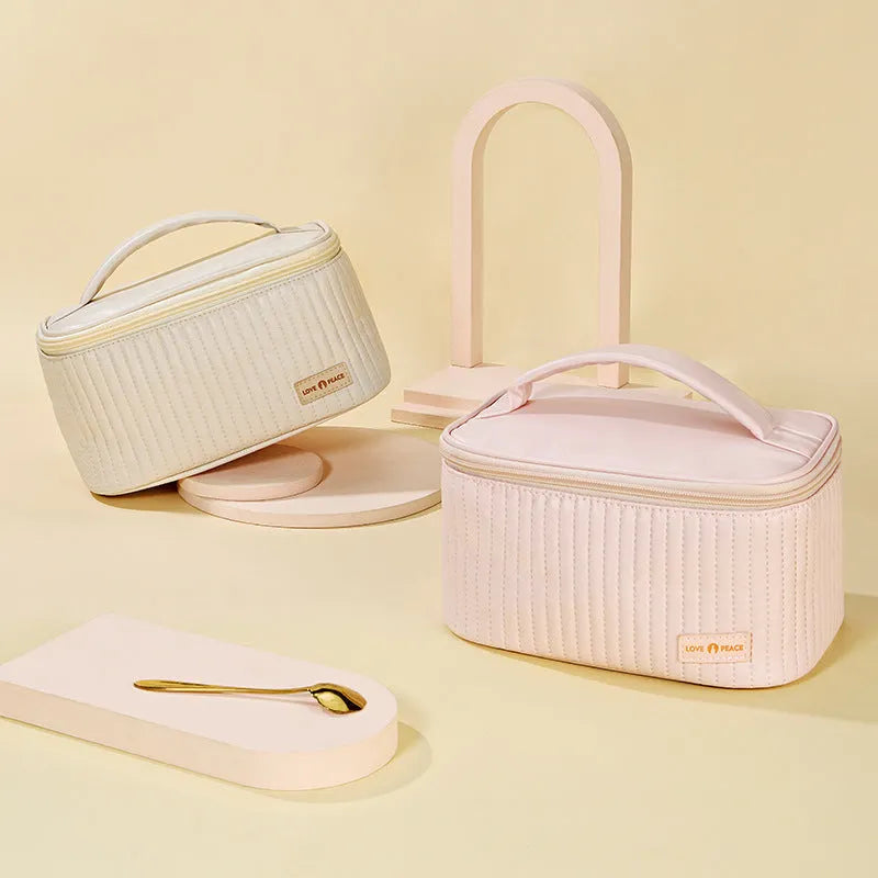 Open-top cake style makeup bag in PU leather, shown in one of six solid colours