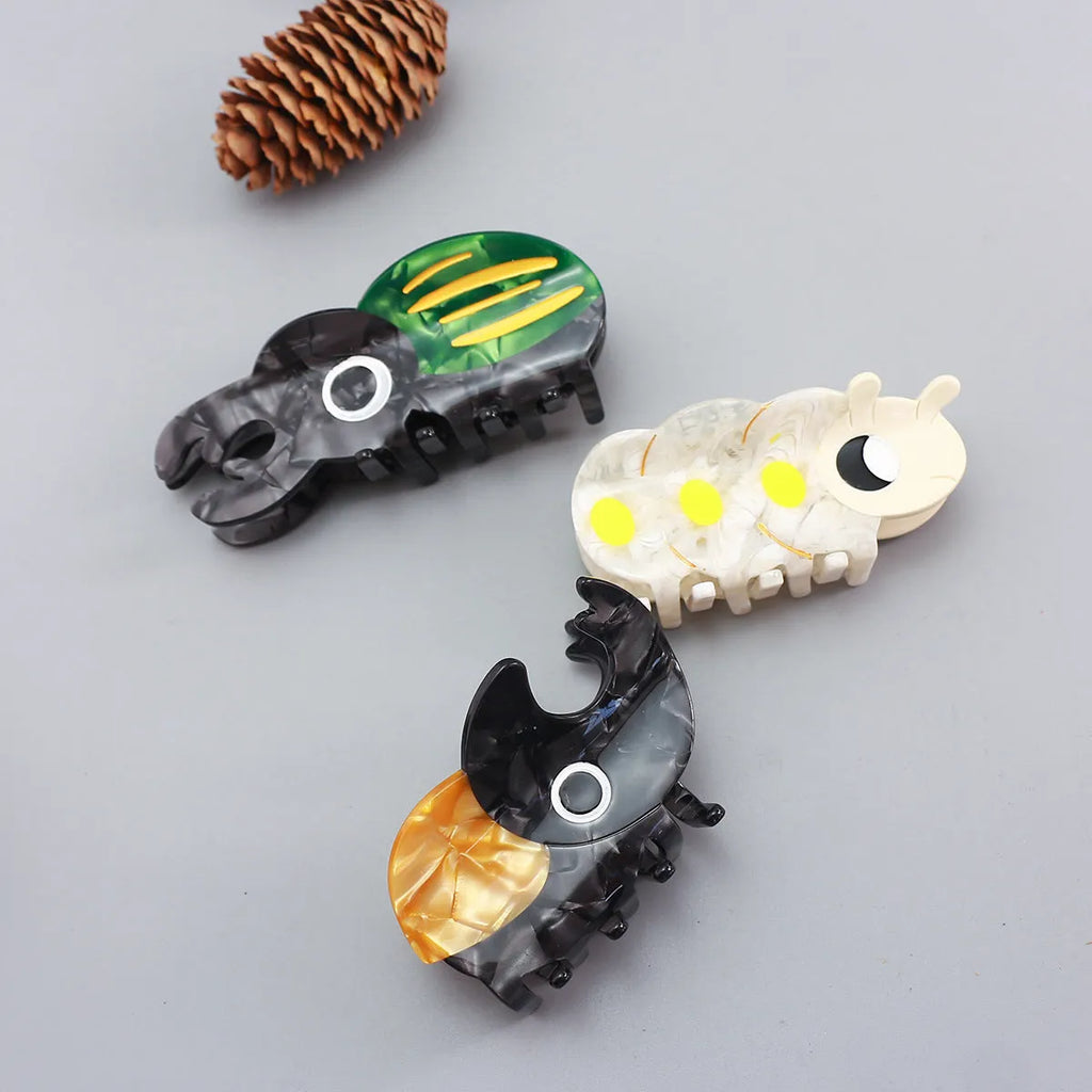Handmade cellulose acetate beetle grip in green colour with cartoon design