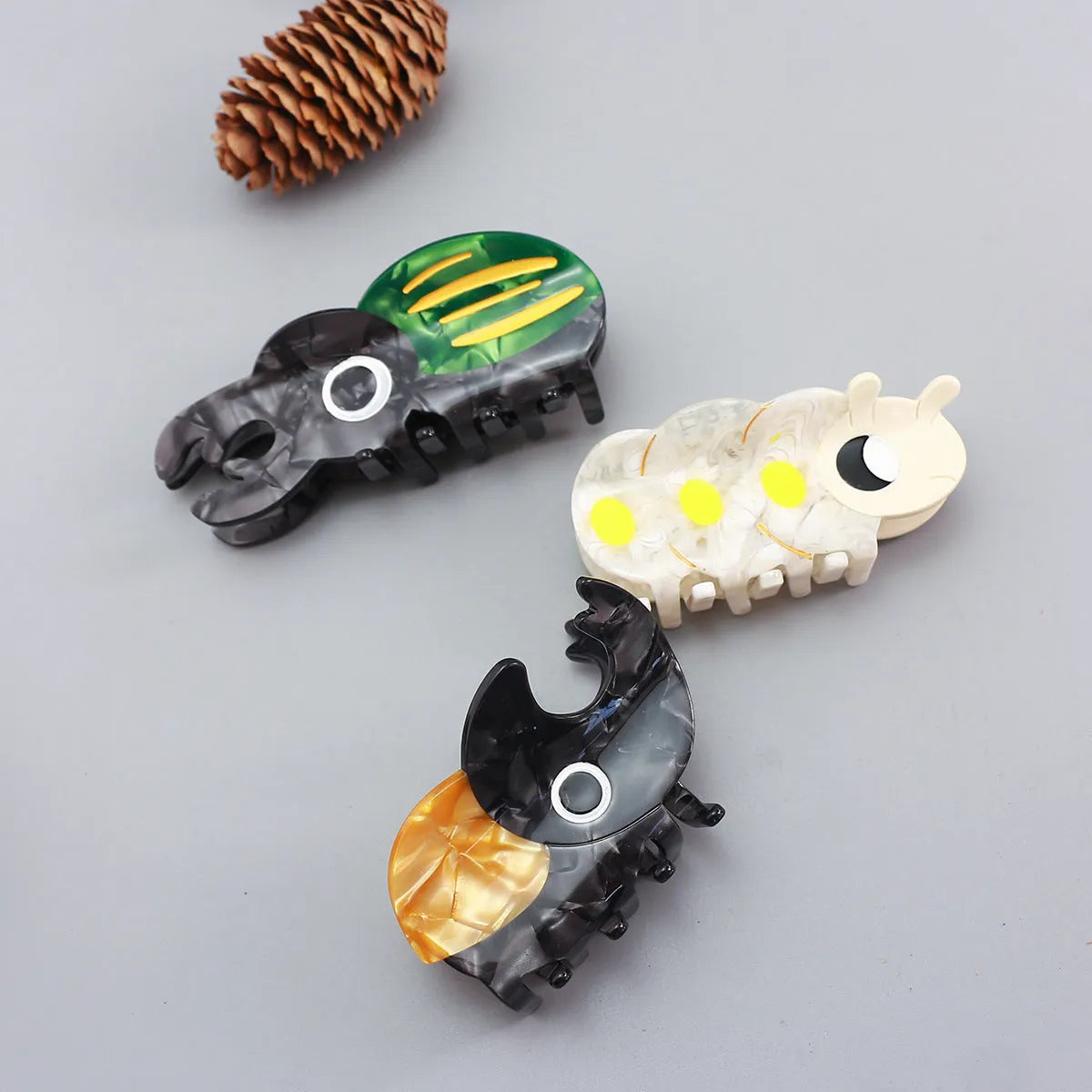 Handmade cellulose acetate beetle grip in green colour with cartoon design