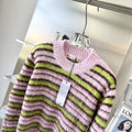 Pink wool knitted cardigan sweater with nap craft texture and regular sleeves