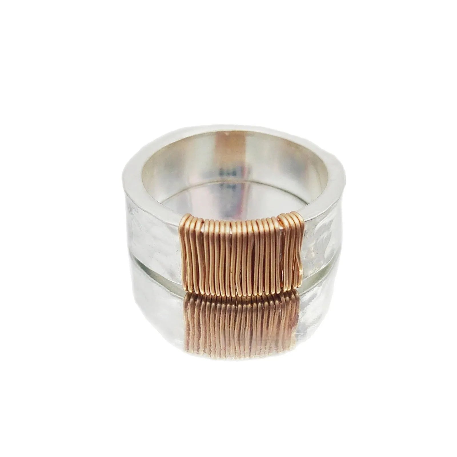 Copper geometric bracelet with irregular coil design in electroplated silver gold colour