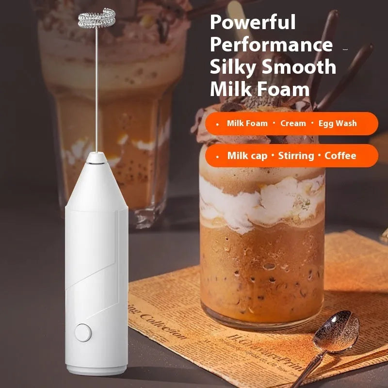 Mini handheld electric milk frother in black, white, or khaki with stainless steel whisk.