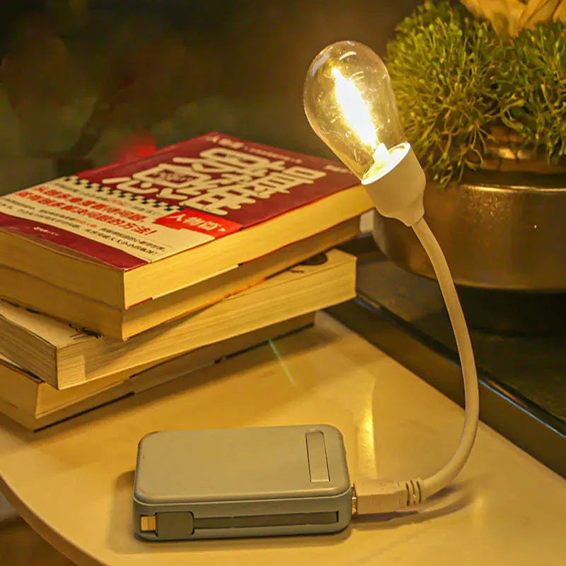 USB rechargeable folding night light with tungsten filament LED bulb in open position