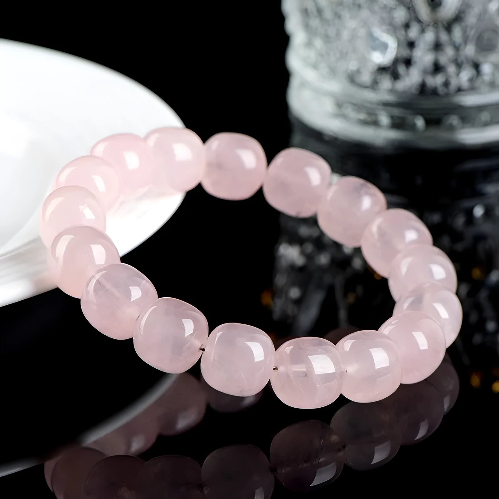 Pink crystal barrel bead bracelet with geometric design and 11-12mm beads