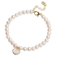 Freshwater pearl bracelet with fan-shaped shell design showing pearls on elastic or chain option