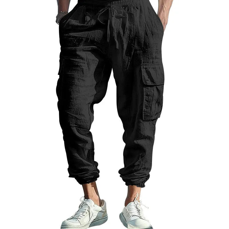 Men's loose-fit linen trousers with ankle ties and multiple pockets in Army Green.