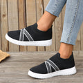 Women's black flat bottom flyknit mesh shoes with tassel detail, round toe, and rubber sole