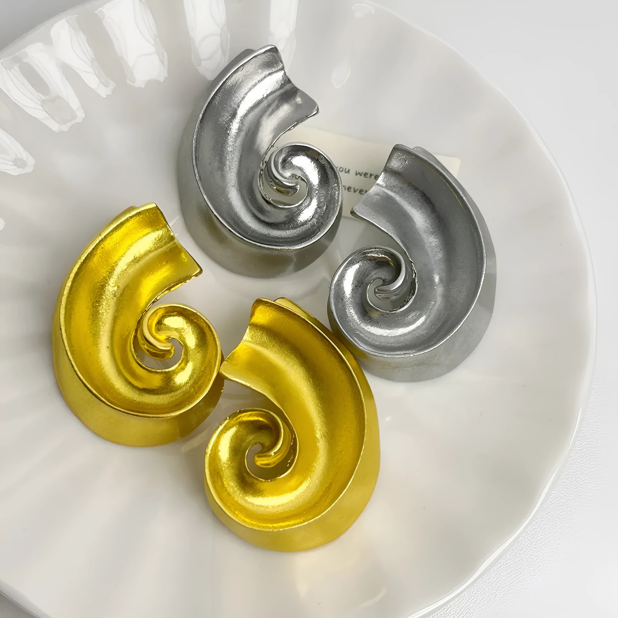 Geometric retro ear studs in gold or silver with 5cm size and alloy construction