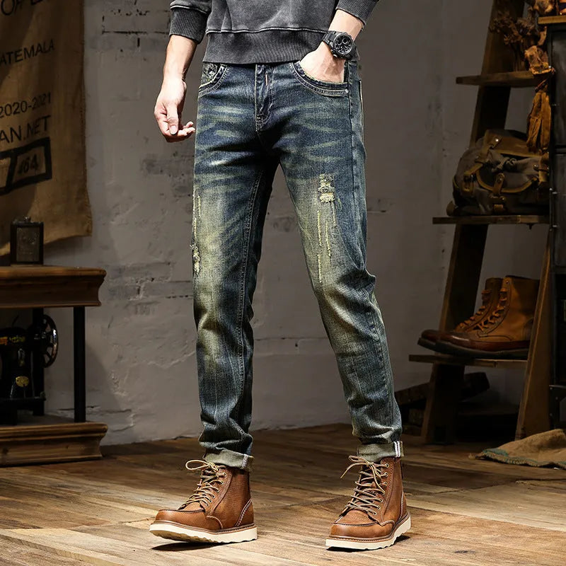 Men's skinny fit jeans in retro colour showing zip fly and tapered leg.