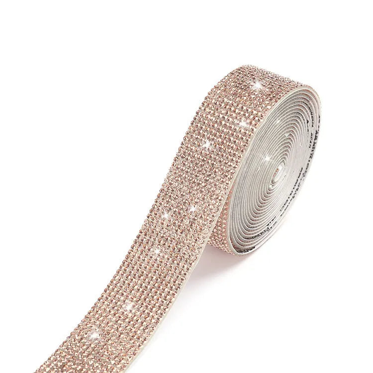 Long glass strip with self-adhesive backing for clothing decoration, shown in white and AB colour.