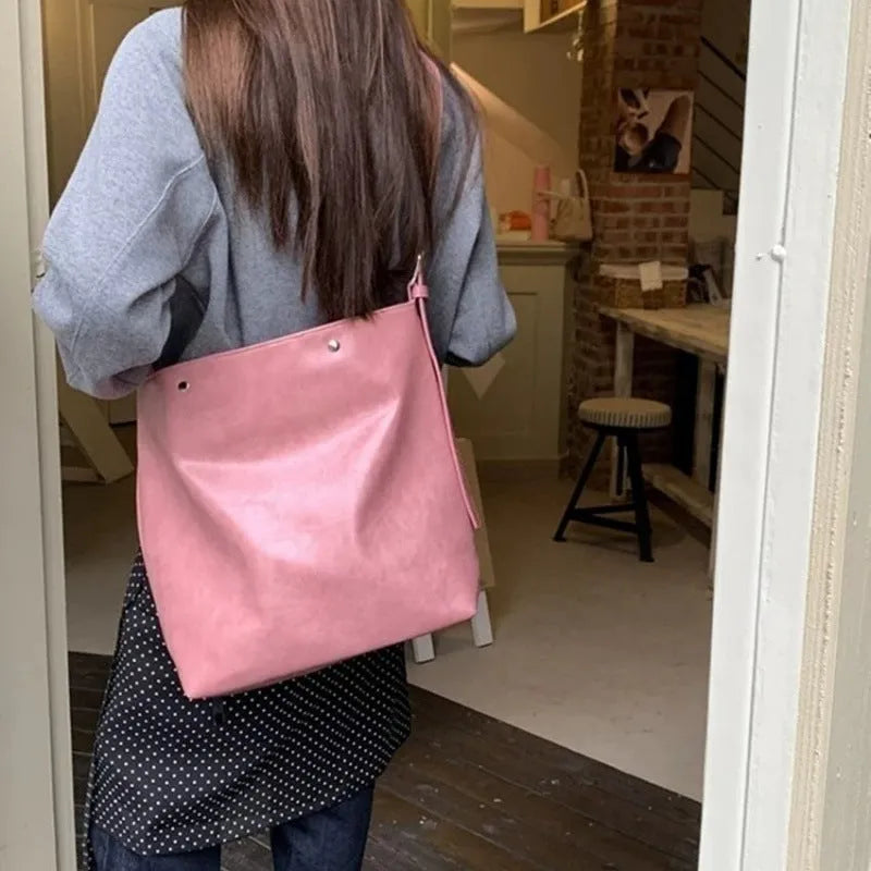 Corduroy one-shoulder commuter bag in pink colour with structured bottom