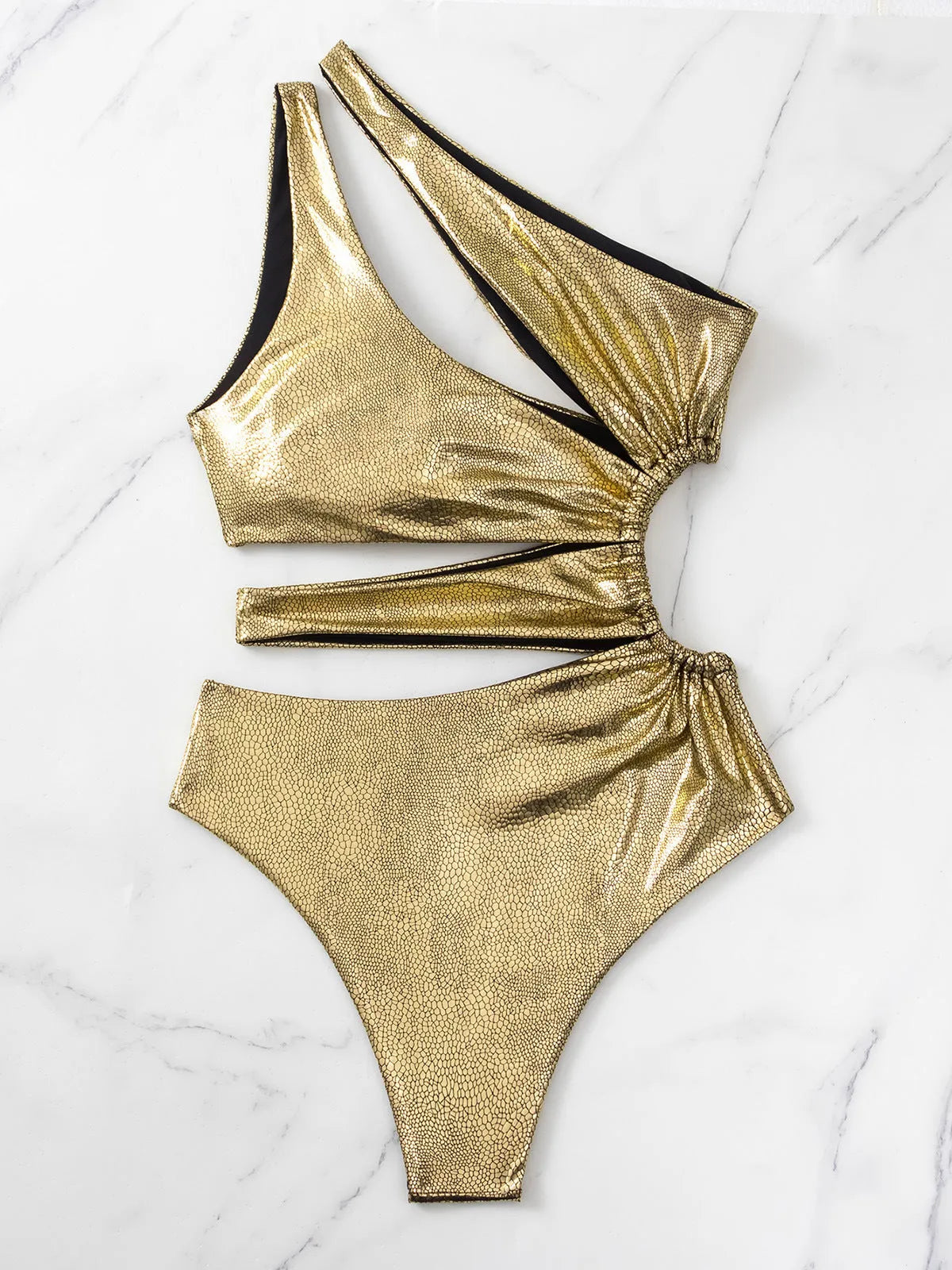 Gold coloured backless one-piece swimsuit for women on a white background