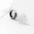 Silver titanium steel retro earrings with a geometric twist and striped design.