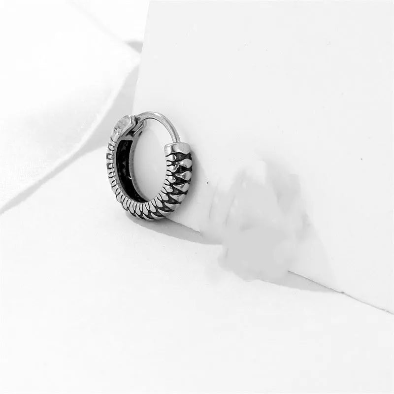 Silver titanium steel retro earrings with a geometric twist and striped design.
