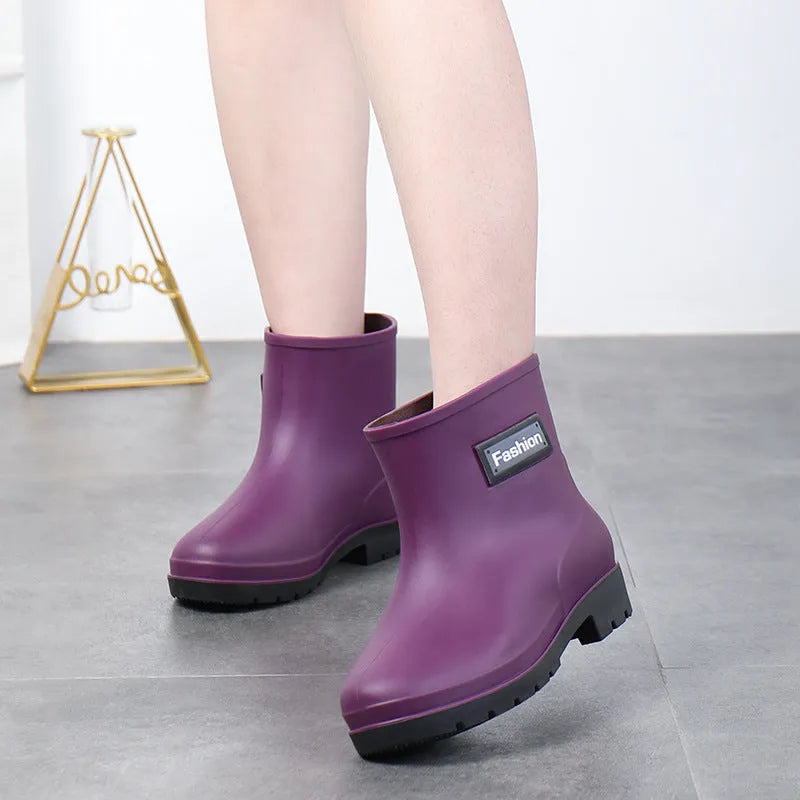 Women's PVC mid-calf rain boots in black with low heel, size 36-40