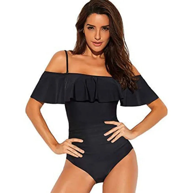 Black strapless one-piece swimsuit with side cut-out details and ruffled shoulder straps.