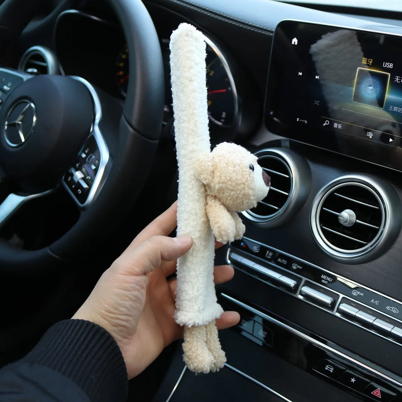 Soft plush car seatbelt shoulder protector with cartoon bear and rabbit designs made from lamb wool.