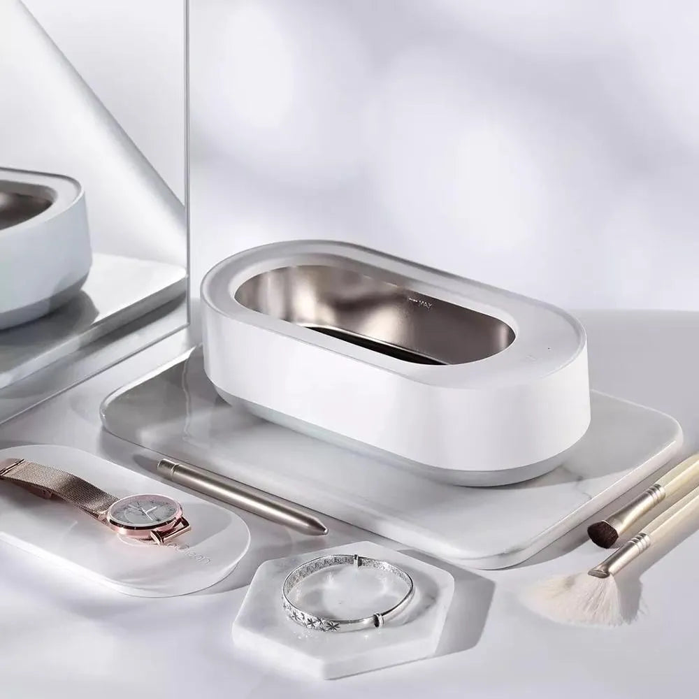 White portable ultrasonic cleaning machine with touch button and stainless steel tank.