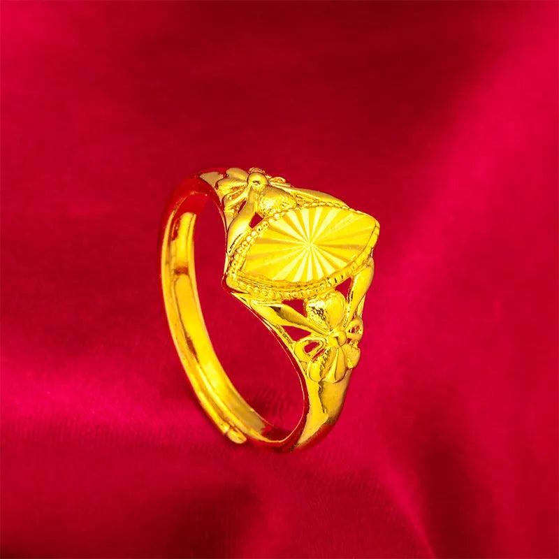 Gold coloured electroplated brass ring with open diamond flower geometry design and texture details