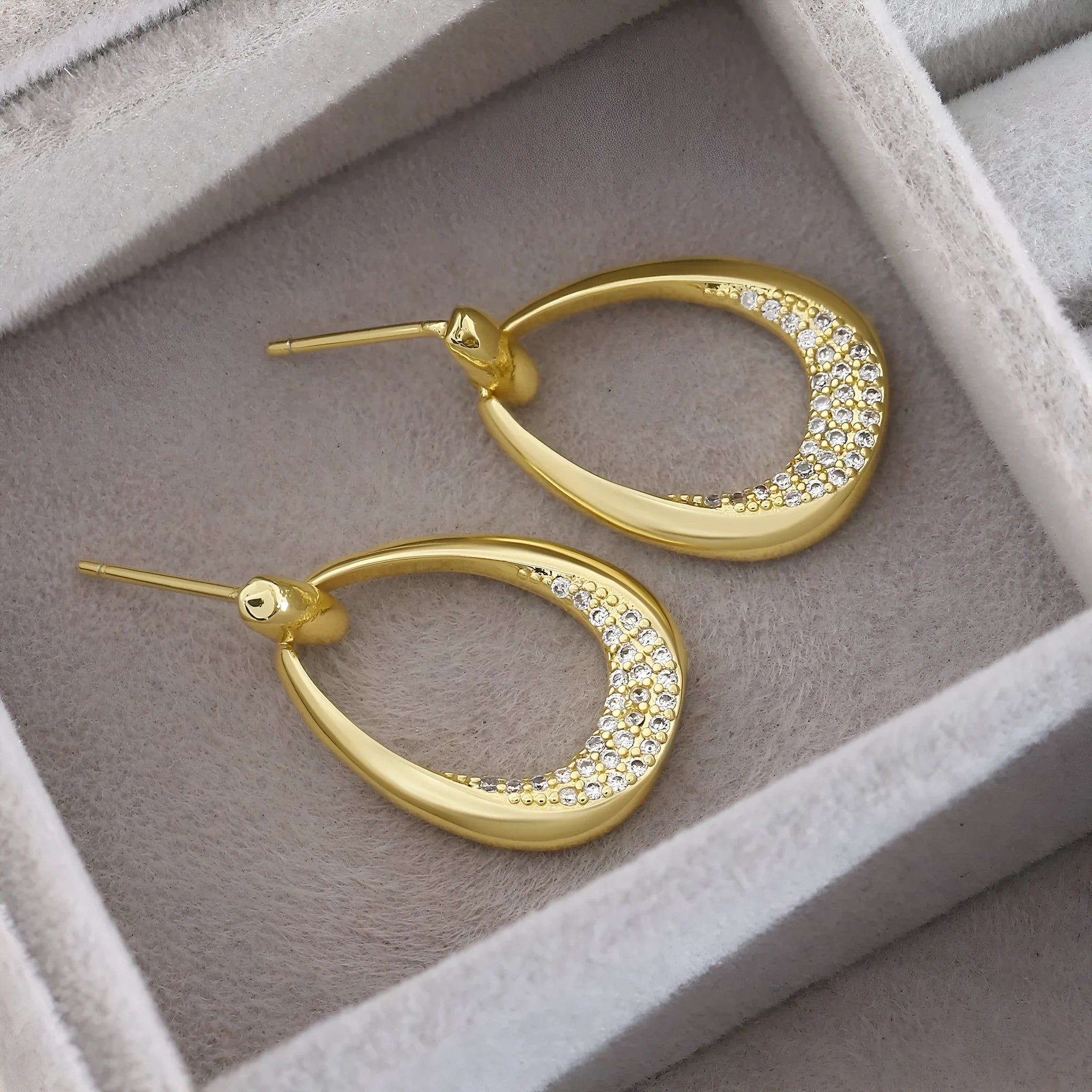 Yellow gold geometric drop earrings with zircon detailing measuring 2.6 by 1.7 centimetres