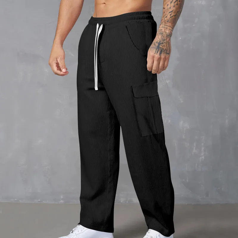 Men's straight-leg corduroy cargo trousers in navy blue with an elastic drawstring waist.