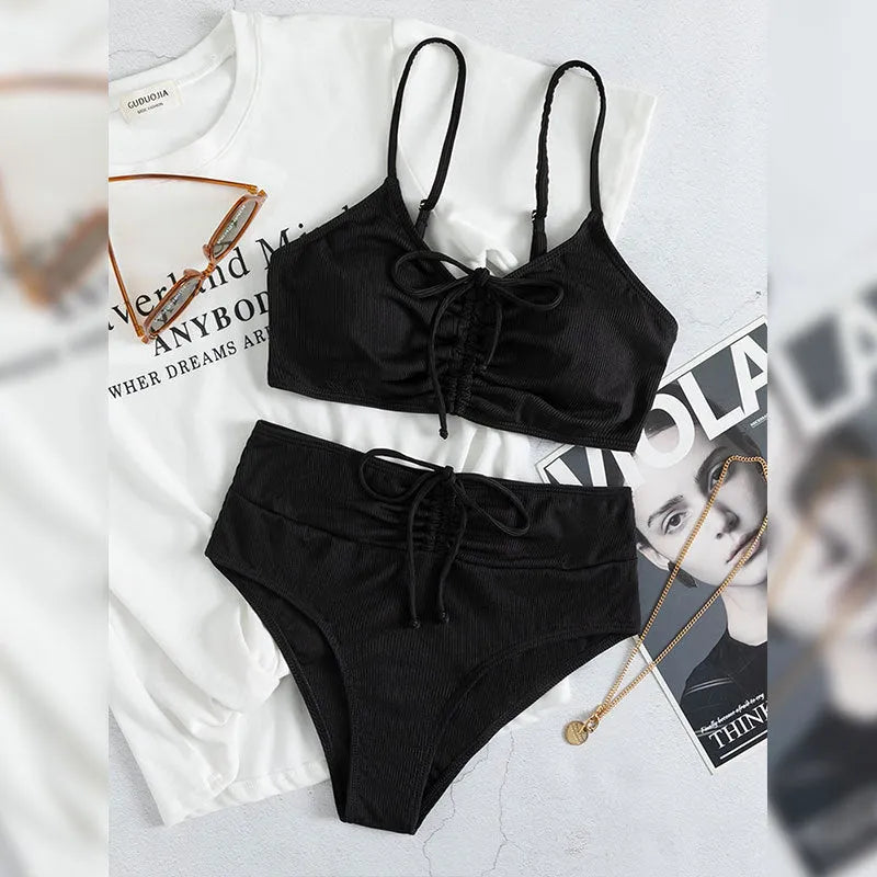 Women's black nylon sling split high waist bikini swimsuit set with top and shorts