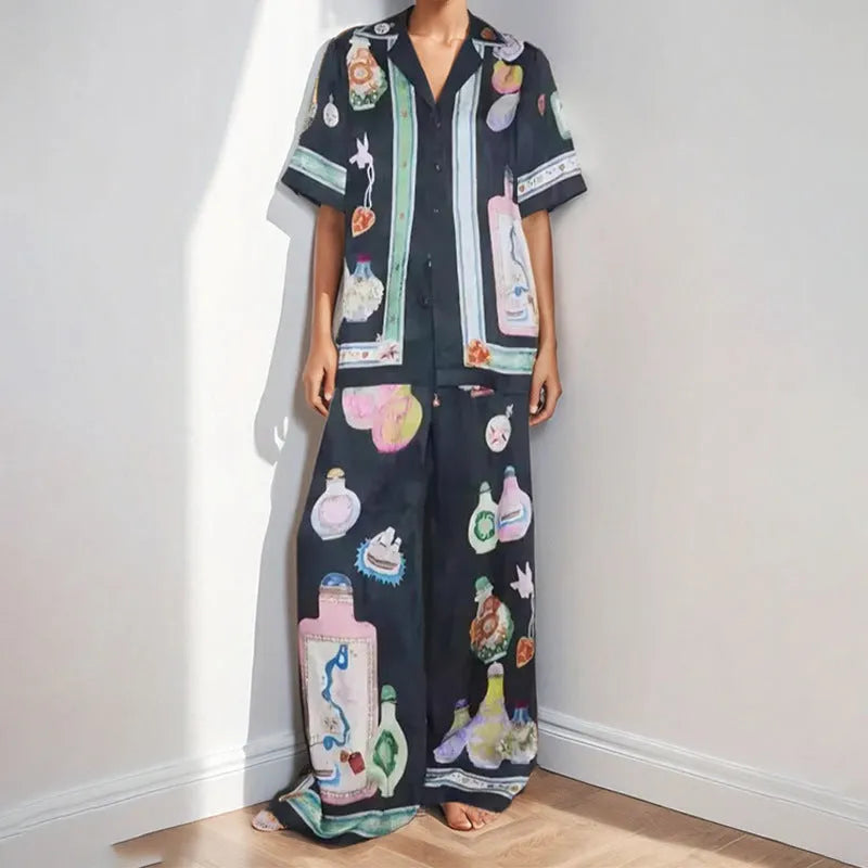 Black women's cartoon print polyester lounge set with cardigan sleeve top and matching trousers